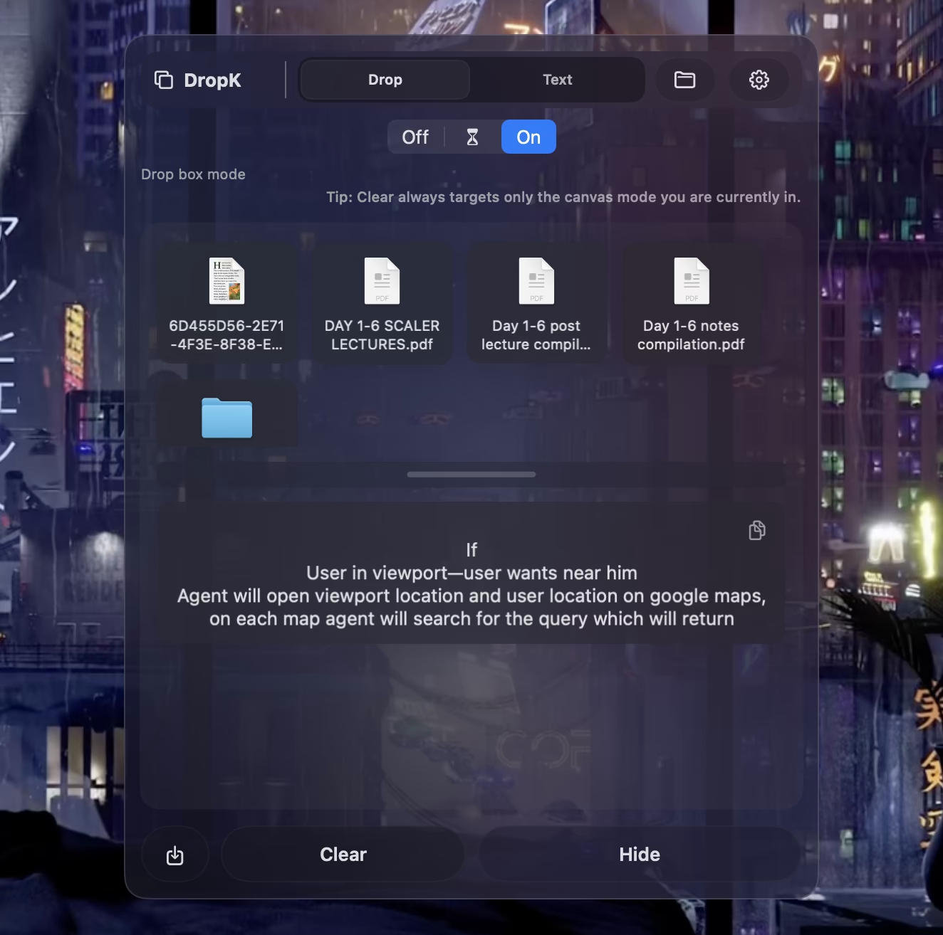 DropK shelf with file thumbnails on a cyberpunk wallpaper.